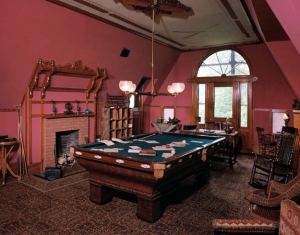 Twain's billiards table spread with papers